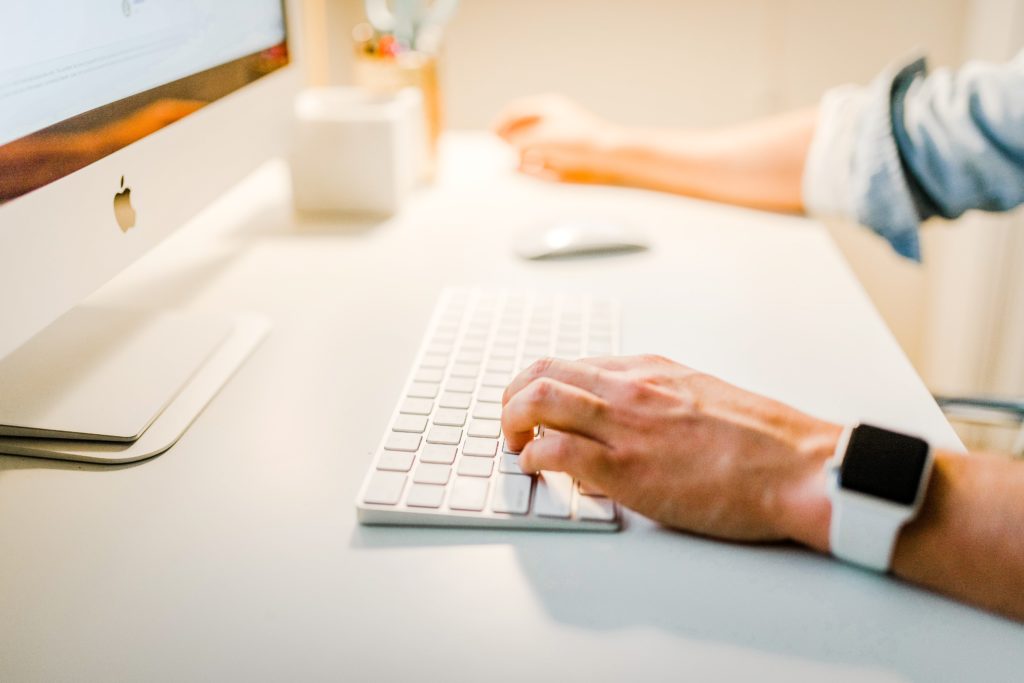 man using iMac