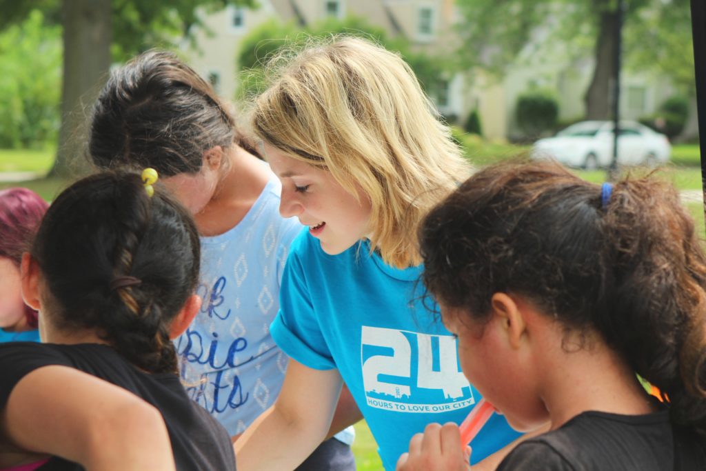 woman volunteering at local event